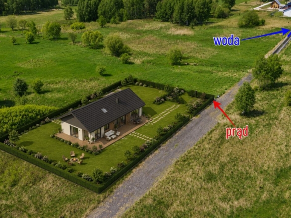 A single-story house with a manicured lawn inside a fenced yard on a rural property, with a gravel road nearby and labeled utilities (water and electricity) in the distance.