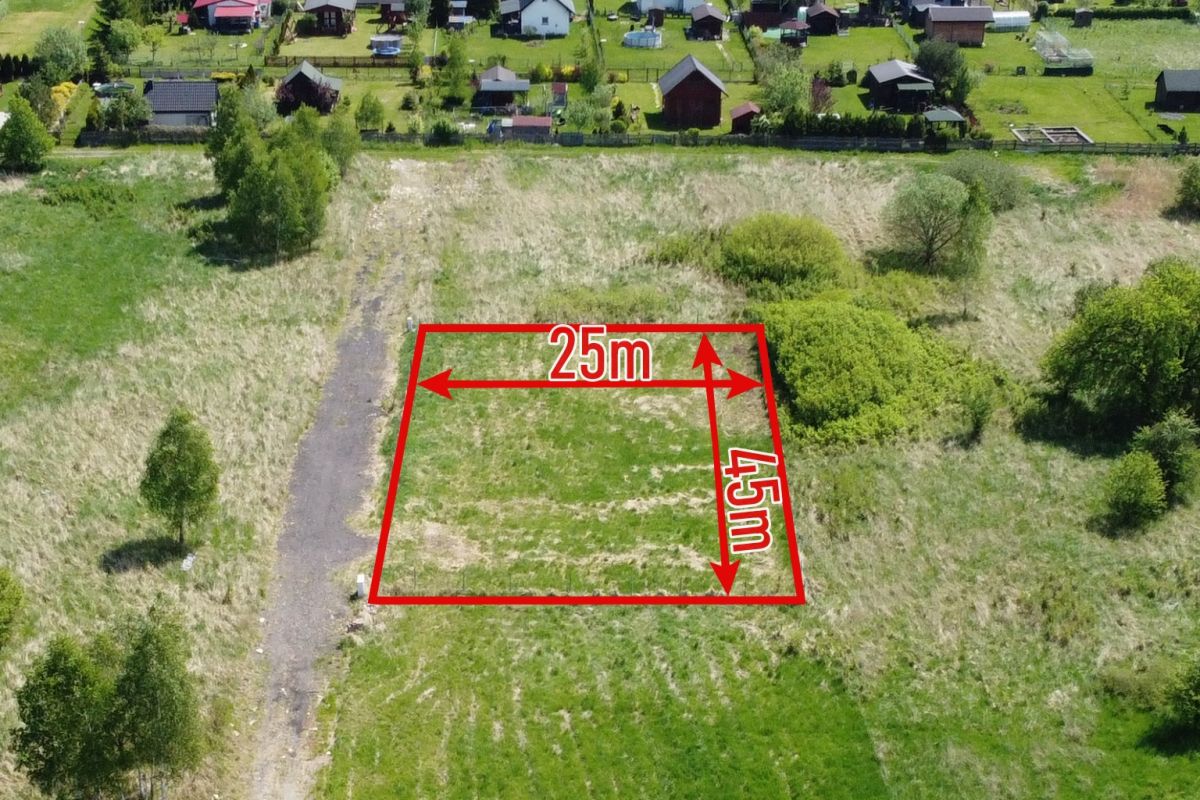 Aerial view of a rectangular vacant plot outlined in red with dimensions 25 m by 45 m.