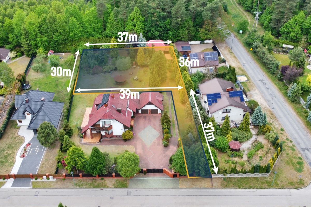 Aerial view of a house with a yellow boundary outlining the lot and dimension labels: 39 m along the front, 37 m along the rear, 30 m on the left side, and 36 m and 37 m on the right edge; visible yard, driveway, and neighboring homes.