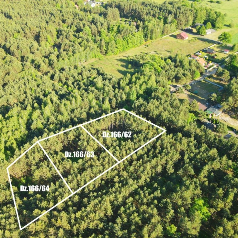 Aerial view of a forested lot with three adjacent parcels outlined in white and labeled Dz.166/64, Dz.166/63, and Dz.166/62, near a small residential area.