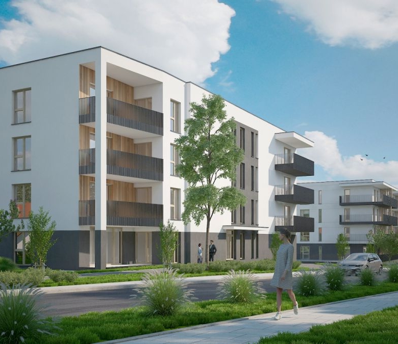 Modern white apartment building with balconies along a tree-lined street on a sunny day,