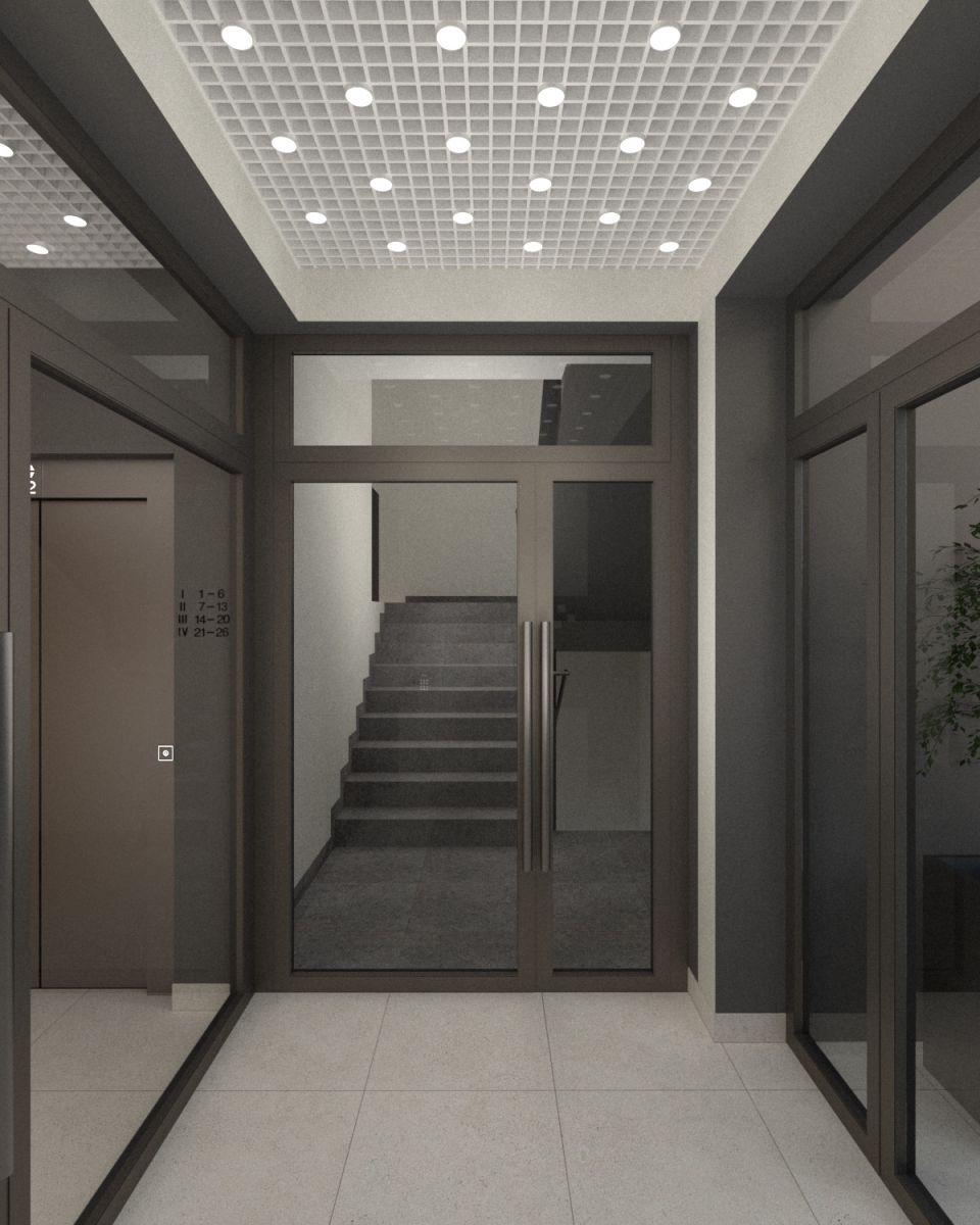 Modern lobby entrance with glass doors opening to a visible stairwell, tiled floor and grid ceiling lights in a contemporary building.