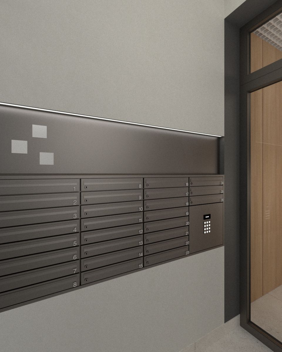 Row of dark metal mailboxes mounted on a wall in a modern lobby, with a numeric keypad panel on the right side.
