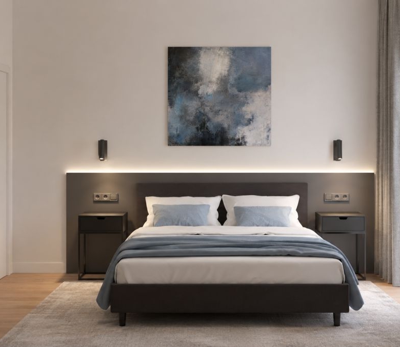 Modern bedroom with a low dark bed, gray headboard, white/blue bedding, two nightstands, and a blue abstract painting above the bed.