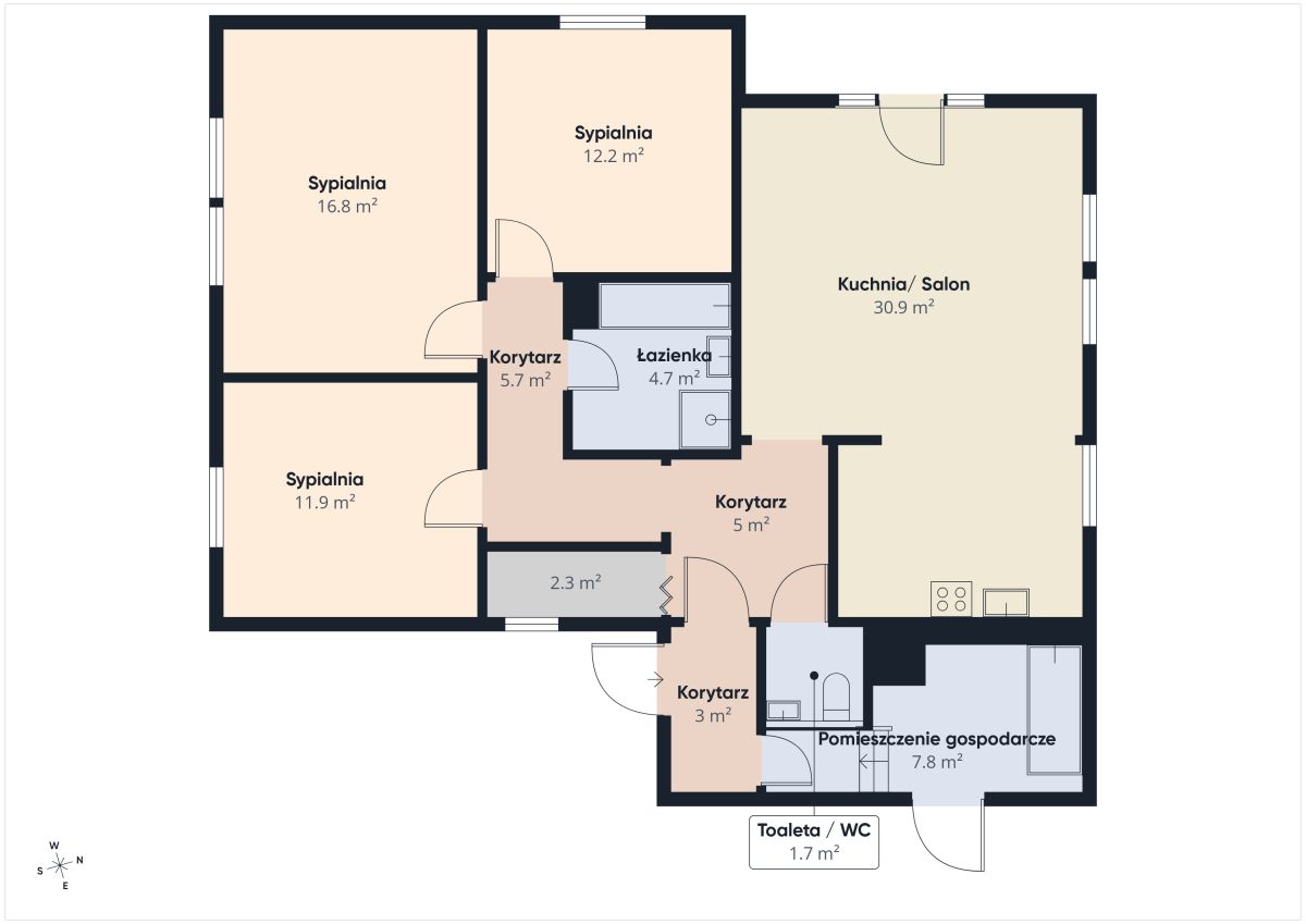 Floor plan of an apartment: three bedrooms, a large kitchen/living area, bathroom, WC, utility room, and corridors.